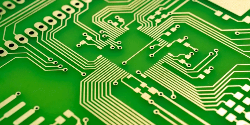 close-up of pathways on a green PCB