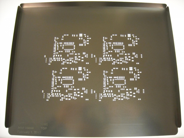 Prototype SMT stencil with detailed apertures for precise PCB solder application.
